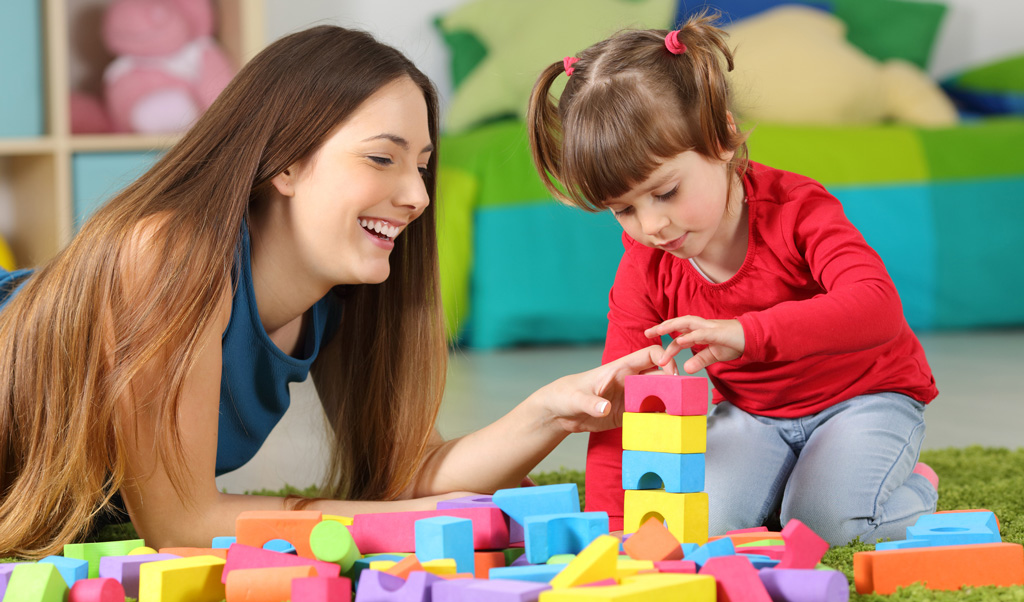 Toddler developing language through play with mother - Credit: iStock.com
